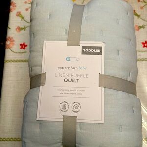 Never opened toddler quilt. Pottery barn.
